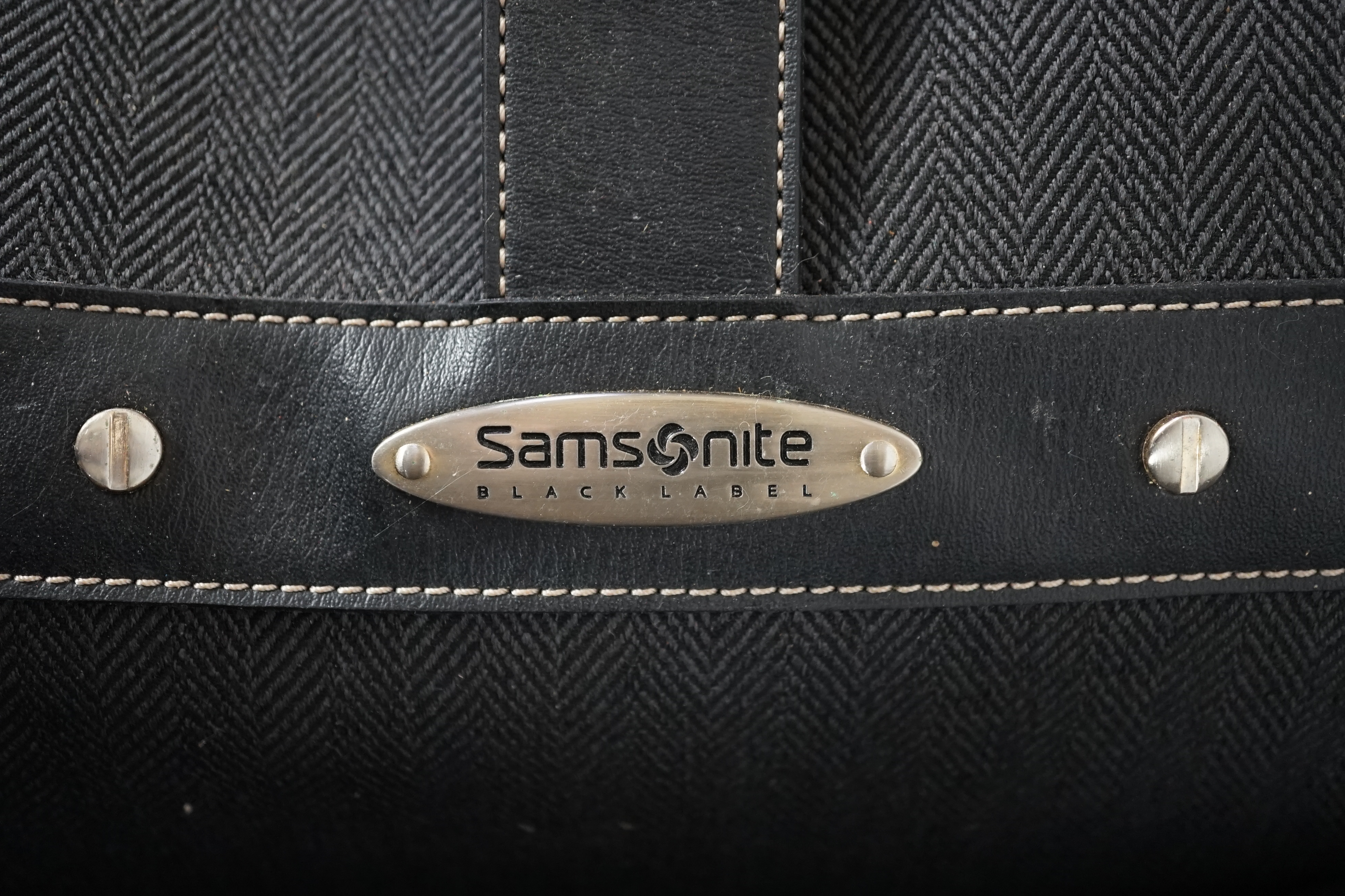 Two Samsonite Black Label charcoal herringbone holdalls, 62cm x 34cm x 40cm and 48cm x 28cm x 34cm